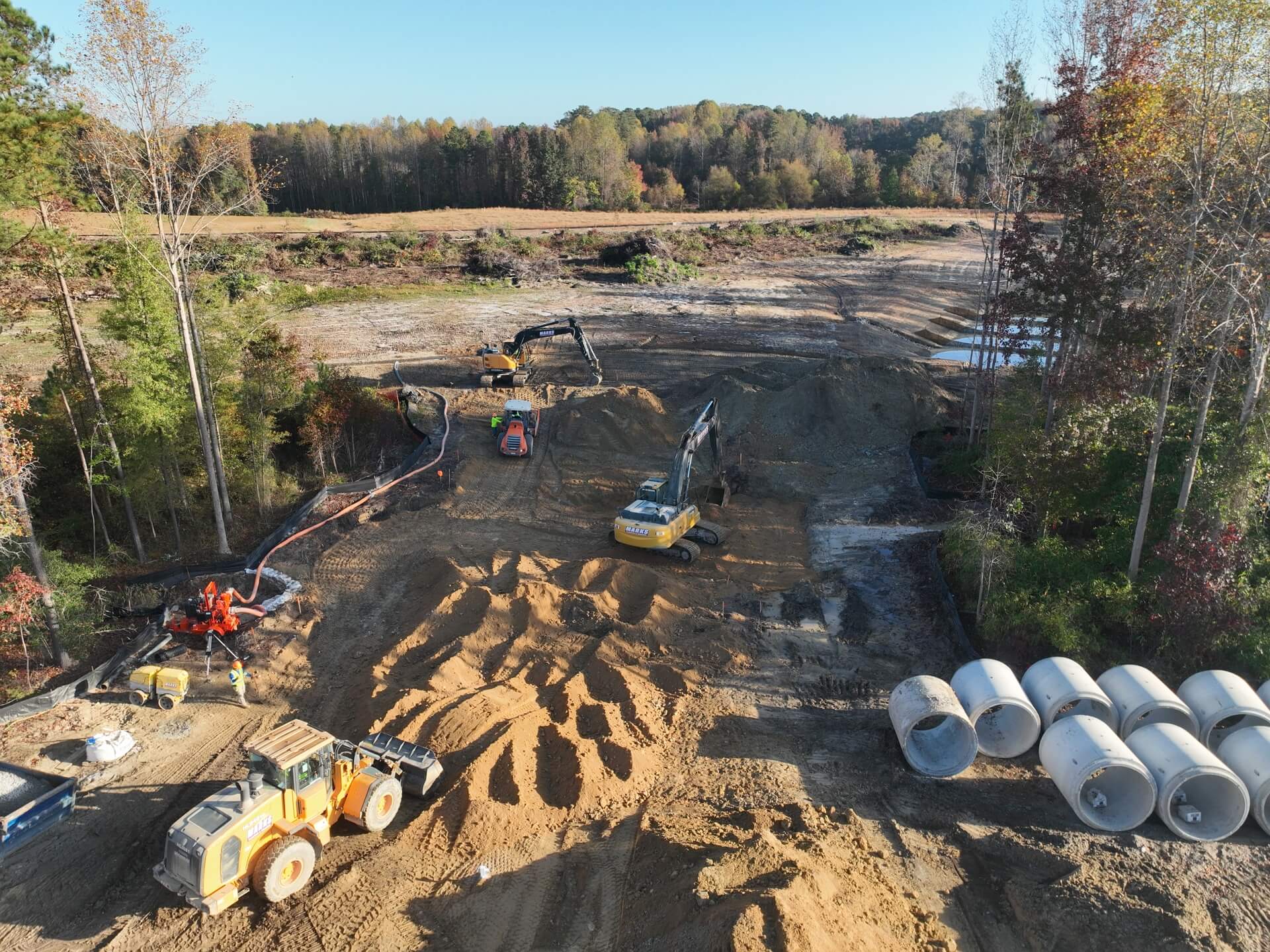 Aerial view of pipe staged for installation on a Marks development