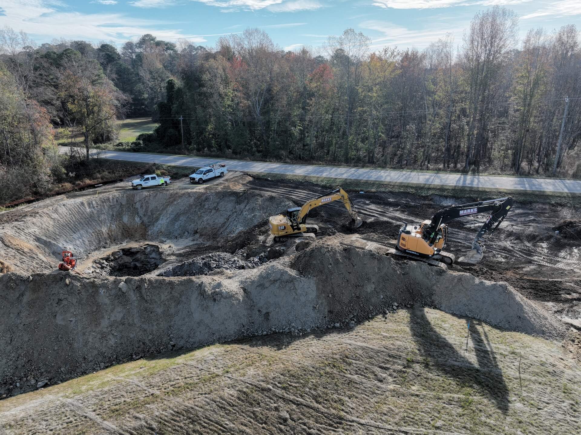 Deep rock excavation for an underground detention system on a Marks site