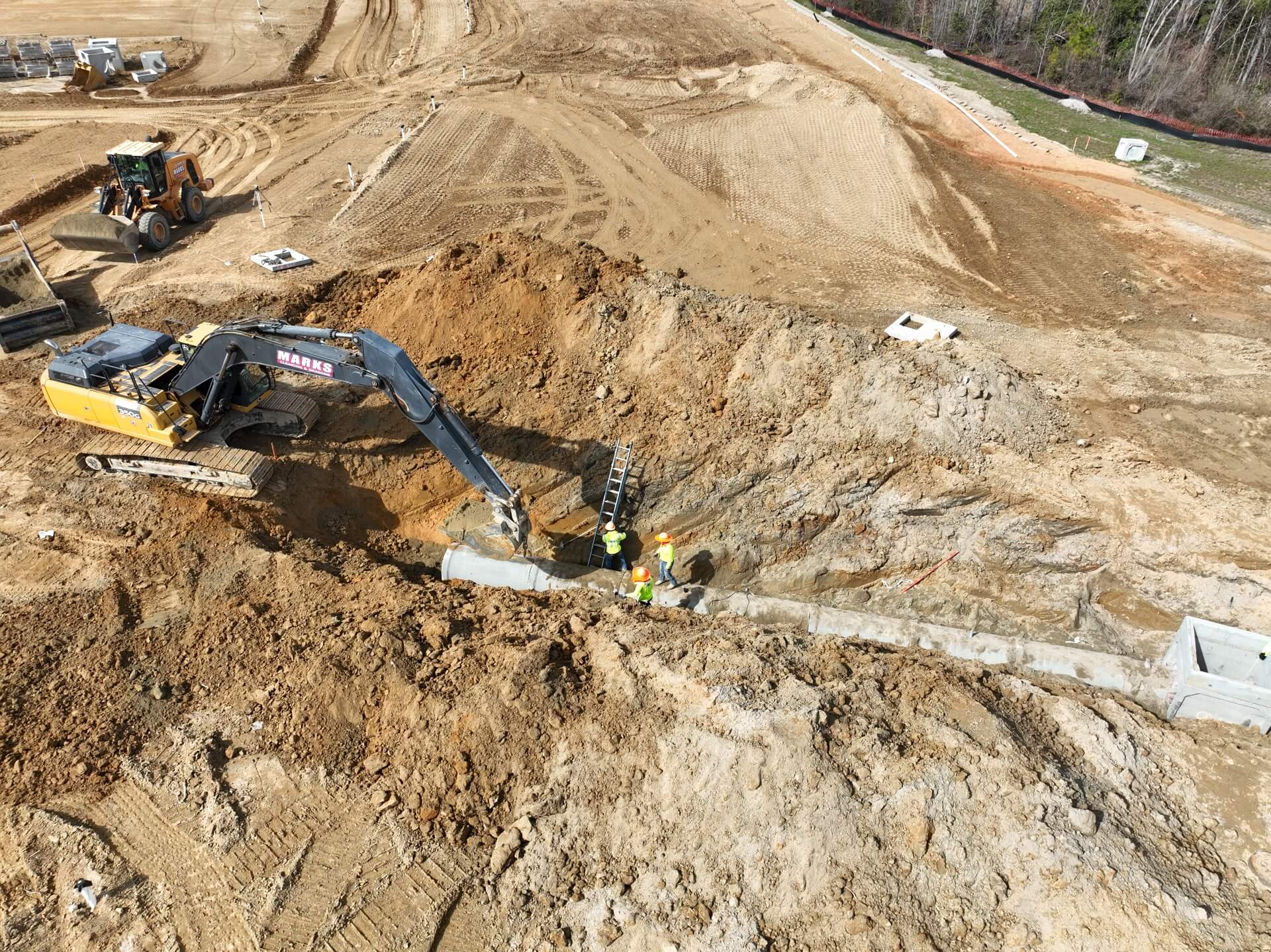 Aerial view of deep utility installation on a Marks Clearing and Grading site